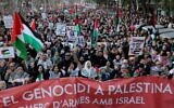 Protesters hold banners and wave Palestinian flags during an anti-Israel, pro-Palestinian rally  in Barcelona on January 20, 2024 (LLUIS GENE / AFP)