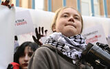 Swedish climate activist Greta Thunberg stages a United Nations Climate Change Conference (COP29) protest outside a UN representative office in Yerevan on November 15, 2024. (Karen Minasyan / AFP)