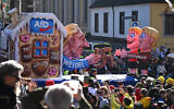 A float portrays co-leader of the far-right Alternative for Germany (AfD) party  Alice Weidel as witch during the parade to celebrate Rose Monday (Rosenmontag) in Duesseldorf, western Germany on March 3, 2025. (Photo by INA FASSBENDER / AFP)