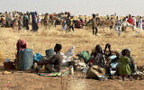 People who fled the Zamzam camp for the internally displaced after it fell under RSF control, rest in a makeshift encampment in an open field near the town of Tawila in war-torn Sudan's western Darfur region on April 13, 2025. (AFP)