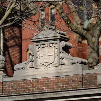Harvard University's motto, "Veritas," meaning "truth," is seen on a gate at Harvard University on April 17, 2025 in Cambridge, Massachusetts. (Sophie Park/Getty Images via AFP)