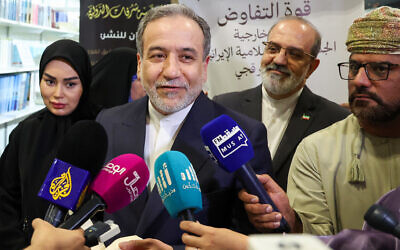 Iran's Foreign Minister Abbas Araghchi speaks to the media during the signing ceremony for his book 'The Power of Negotiation' at the Muscat International Book fair in Oman, April 25, 2025. (Haitham AL-SHUKAIRI / AFP)