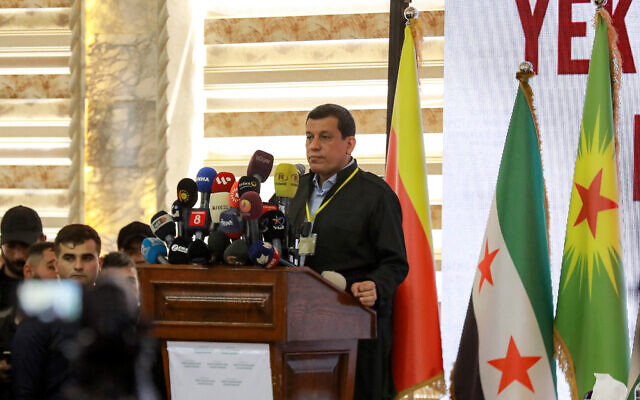 Mazloum Abdi, commander-in-chief of the Syrian Democratic Forces (SDF), speaks during the pan-Kurdish "Unity and Consensus" conference in Qamishli, in northeastern Syria on April 26, 2025. (Delil SOULEIMAN / AFP)