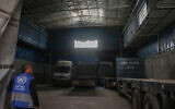 A member of staff enters an empty UNRWA aid distribution warehouse at al-Jalaa street in Gaza City on April 28, 2025. (Omar AL-QATTAA / AFP)