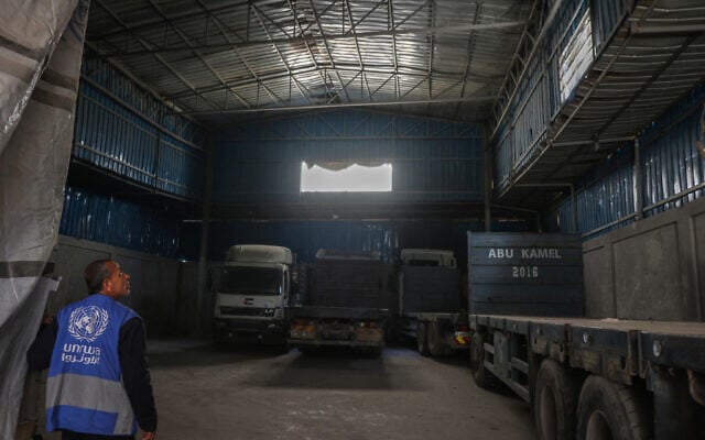 A member of staff enters an empty UNRWA aid distribution warehouse at al-Jalaa street in Gaza City on April 28, 2025. (Omar AL-QATTAA / AFP)