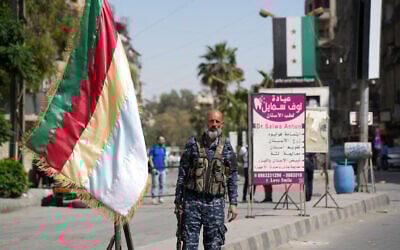 A member of the Druze security forces stands guard in Jaramana in the suburb of Damascus on April 29, 2025, following overnight sectarian clashes. (Rami al SAYED / AFP)