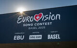 A sign for the Eurovision Song Contest is seen on the St. Jakobshalle arena that will host the 2025 edition of the competition, April 30, 2025. (Fabrice Coffrini/AFP)