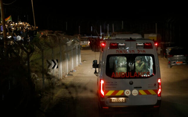 An Israeli military ambulance transporting injured Syrian Druze to an Israeli hospital crosses the border fence near the Druze village of Majdal Shams in the Golan Heights on April 30, 2025 (Jalaa MAREY / AFP)