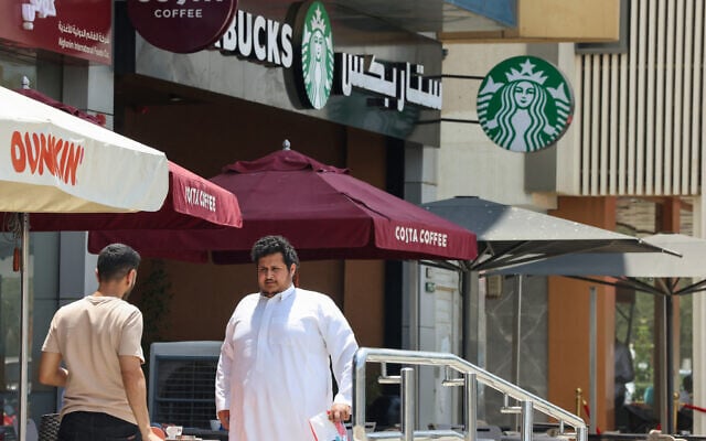 People walk past a Starbucks coffee shop in Riyadh, Saudi Arabia, on May 1, 2025. (Photo by Fayez Nureldine / AFP) People walk past a Starbucks coffee shop in Riyadh, Saudi Arabia, on May 1, 2025. (Photo by Fayez Nureldine / AFP)