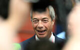Nigel Farage, Reform UK party leader, speaks with the press during the Runcorn by-election on May 2, 2025. (Oli Scarff / AFP)