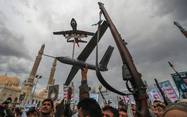 Yemenis brandish drone replicas and traditional rifles during a pro-Palestinian, anti-Israel rally in Sanaa on May 2, 2025. (Mohammed HUWAIS / AFP)