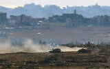 An Israeli army military vehicle drives at a position at Israel's border with the Gaza Strip, on May 6, 2025. (Jack GUEZ / AFP)