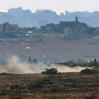 An Israeli army military vehicle drives at a position at Israel's border with the Gaza Strip, on May 6, 2025. (Jack GUEZ / AFP)