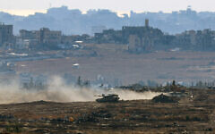 An Israeli army military vehicle drives at a position at Israel's border with the Gaza Strip, on May 6, 2025. (Jack GUEZ / AFP)