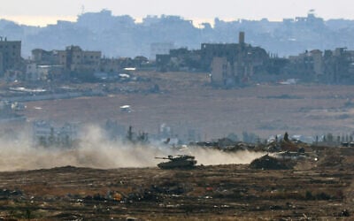 An Israeli army military vehicle drives at a position at Israel's border with the Gaza Strip, on May 6, 2025. (Jack GUEZ / AFP)