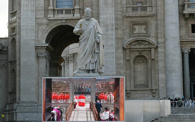 Faithful watch a giant screen displaying the holy mass of cardinals to the Sistine chapel, at St Peter's Square on the first day of the conclave to elect the next pope, at the Vatican, May 7, 2025. (Stefano Rellandini / AFP) Faithful watch a giant screen displaying the holy mass of cardinals to the Sistine chapel, at St Peter's Square on the first day of the conclave to elect the next pope, at the Vatican, May 7, 2025. (Stefano Rellandini / AFP)