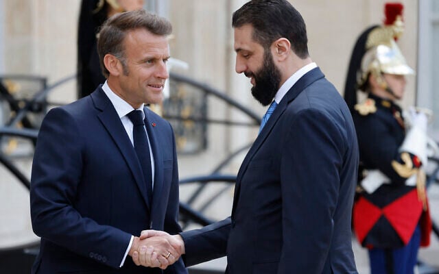 France's President Emmanuel Macron (L) greets Syrian interim President Ahmed al-Sharaa upon his arrival for their meeting at the Elysee presidential palace in Paris on May 7, 2025. (Ludovic MARIN / AFP) France's President Emmanuel Macron (L) greets Syrian interim President Ahmed al-Sharaa upon his arrival for their meeting at the Elysee presidential palace in Paris on May 7, 2025. (Ludovic MARIN / AFP)
