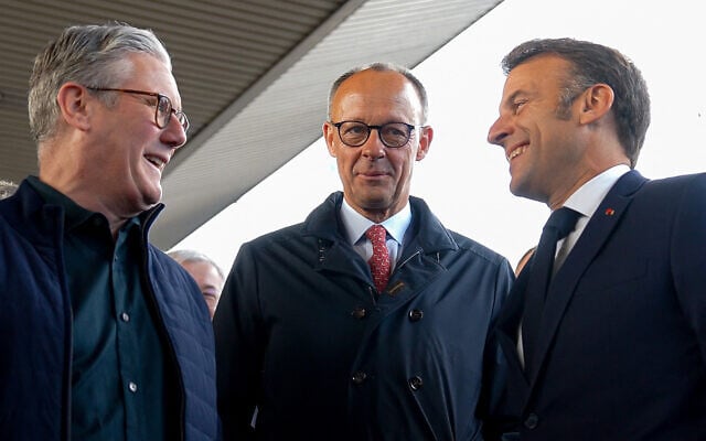 France's President Emmanuel Macron (R), Britain's Prime Minister Keir Starmer (L) and Germany's Chancellor Friedrich Merz (C) arrive at Kyiv railway station, ahead of a gathering of European leaders in the Ukranian capital, on May 10, 2025. (UKRAINIAN PRESIDENTIAL PRESS SERVICE / AFP)