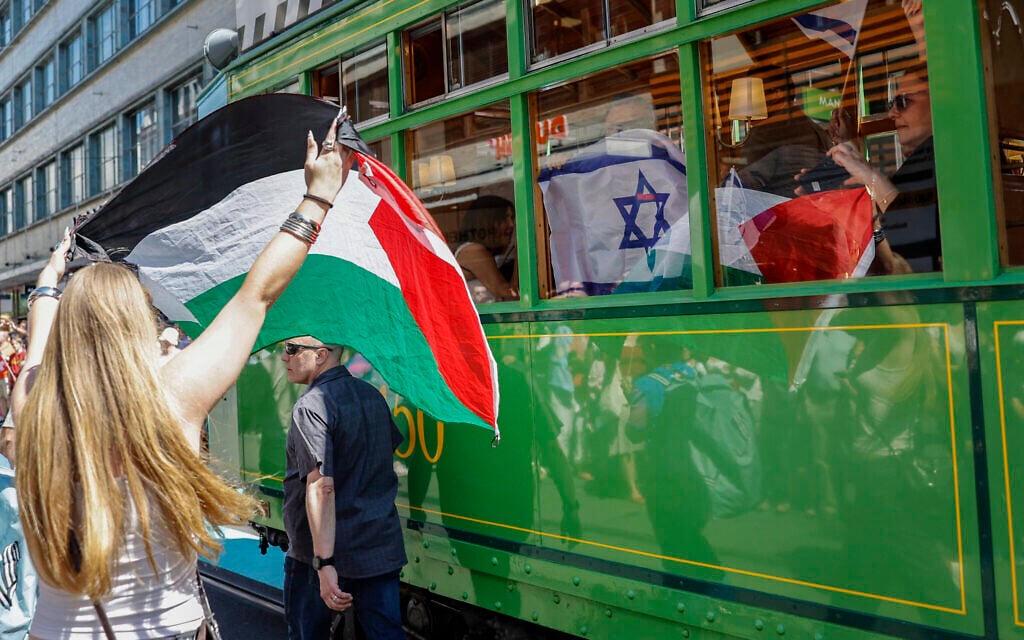 A protestor holds a Palestinian flag as she takes part in a demonstration against Israel during the Eurovision Song Contest 2025 opening ceremony in Basel, Switzerland, on May 11, 2025. (Stefan Wermuth / AFP)