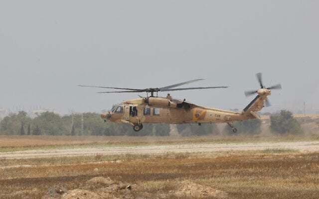 An Israeli army helicopter lands in Reim military base near the Israel Gaza border on May 12, 2025 ahead of the expected release of US-Israeli hostage soldier Edan Alexander. (Gil Cohen-Magen/AFP)