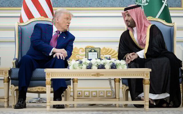 US President Donald Trump, left, and Saudi Crown Prince Mohammed Bin Salman talk before a coffee ceremony at the Royal Court in Riyadh on May 13, 2025. (Photo by Brendan Smialowski / AFP)