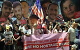 Relatives and supporters of the Gaza hostages call for the US to intervene for their release, at a protest in front of the US embassy branch office in Tel Aviv, on May 13, 2025,  (Jack Guez/AFP)