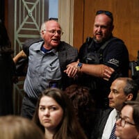 Ben Cohen, co-founder of Ben and Jerry's, is detained by U.S. Capitol Police for disrupting proceedings during a hearing with US Secretary of Health and Human Services Robert F. Kennedy Jr. before the Senate Committee on Health, Education, Labor, and Pensions on Capitol Hill on May 14, 2025 in Washington, DC. (Samuel Corum/Getty Images/AFP)