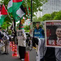 An anti-Israel protest in front of the Japan National Press Club, where Israeli Foreign Minister Gideon Sa'ar is scheduled to hold a press conference in Tokyo on May 14, 2025. (Kazuhiro NOGI / AFP)