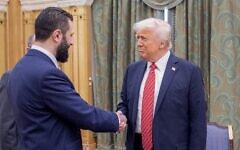 A cropped handout picture provided by the Saudi Royal Palace shows US President Donald Trump (R) shaking hands with Syria's interim president Ahmed al-Sharaa (L) in Riyadh on May 14, 2025. (Bandar AL-JALOUD / Saudi Royal Palace / AFP)