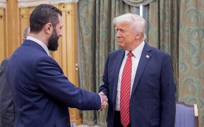 US President Donald Trump, right, shakes hands with Syria's interim president, Ahmed al-Sharaa, in Riyadh, Saudi Arabia, May 14, 2025. (Bandar AL-JALOUD / Saudi Royal Palace / AFP)