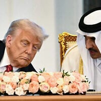 Qatar's Emir Sheikh Tamim bin Hamad al-Thani (R) and US President Donald Trump sit side by side at the Royal Palace in Doha on May 14, 2025. (Brendan SMIALOWSKI / AFP)