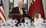 US President Donald Trump (L) speaks with Qatar's Emir Sheikh Tamim bin Hamad al-Thani at the start of a state dinner at the Lusail Palace in Doha on May 14, 2025. (Brendan SMIALOWSKI / AFP)