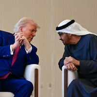 UAE President Sheikh Mohamed bin Zayed Al Nahyan (R) welcomes his US counterpart Donald Trump upon arrival at the presidential terminal in Abu Dhabi on May 15, 2025. (Giuseppe Cacae/AFP)