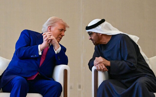 UAE President Sheikh Mohamed bin Zayed Al Nahyan (R) welcomes his US counterpart Donald Trump upon arrival at the presidential terminal in Abu Dhabi on May 15, 2025. (Giuseppe Cacae/AFP)