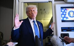 US President Donald Trump speaks to members of the media accompanying him aboard Air Force One, after leaving Abu Dhabi, the United Arab Emirates, at the end of his Middle East tour on May 16, 2025. (Brendan SMIALOWSKI / AFP)