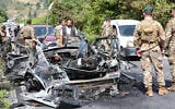 Lebanese army soldiers stand next to a destroyed car that was targeted in an Israeli drone strike in Abu al-Aswad in southern Lebanon on May 17, 2025. . (Photo by Mahmoud ZAYYAT / AFP)