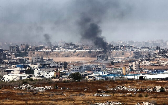This picture, taken from near the Gaza border in southern Israel, shows smoke billowing over destroyed buildings on the Gaza Strip during reported Israeli bombardment, May 17, 2025. (Jack GUEZ / AFP)