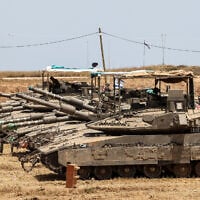This picture taken from a position in southern Israel shows Israeli tanks deployed on the border with the Gaza Strip on May 17, 2025. (Jack GUEZ / AFP)