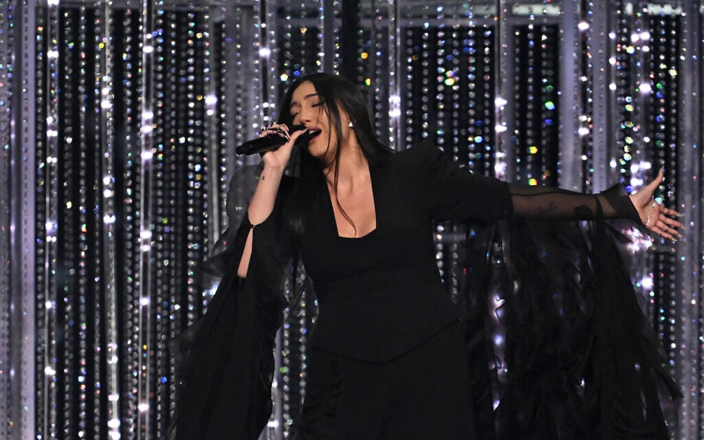 Israeli singer Yuval Raphael performs 'New Day Will Rise' at the grand final of the Eurovision Song Contest 2025, at the St. Jakobshalle arena in Basel on May 17, 2025. (Fabrice COFFRINI / AFP)