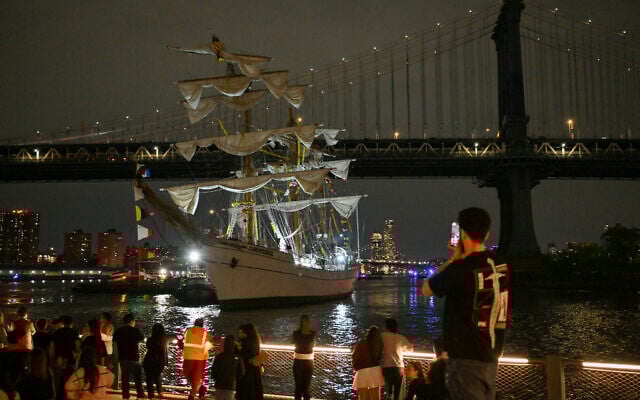 People watch as a Mexican Navy training ship is pulled away after it slammed into the nearby Brooklyn Bridge in New York on May 17, 2025 (ANGELA WEISS / AFP) People watch as a Mexican Navy training ship is pulled away after it slammed into the nearby Brooklyn Bridge in New York on May 17, 2025 (ANGELA WEISS / AFP)
