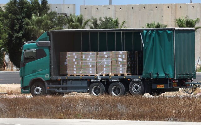 A truck carrying aid makes its way to the Gaza Strip from the Israeli Kerem Shalom crossing, on May 20, 2025 (Photo by Jack GUEZ / AFP) A truck carrying aid makes its way to the Gaza Strip from the Israeli Kerem Shalom crossing, on May 20, 2025 (Photo by Jack GUEZ / AFP)