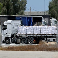 A truck carrying aid enters the Gaza Strip from the Israeli Kerem Shalom crossing, on May 20, 2025. (Jack GUEZ / AFP)