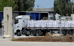 A truck carrying aid enters the Gaza Strip from the Israeli Kerem Shalom crossing, on May 20, 2025. (Jack GUEZ / AFP)