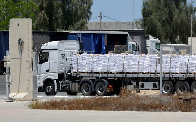 A truck carrying aid enters the Gaza Strip from the Israeli Kerem Shalom crossing, on May 20, 2025. (Jack GUEZ / AFP)