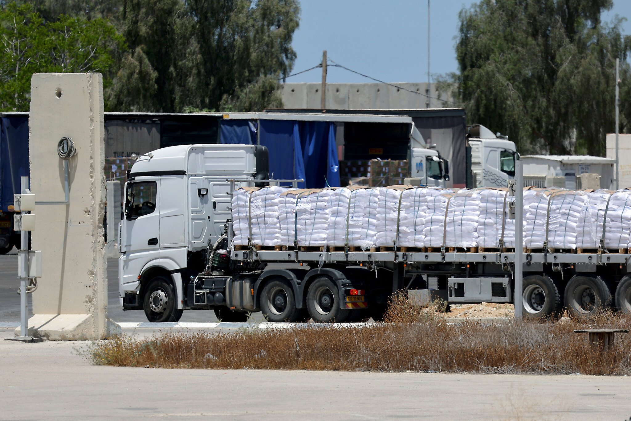 Israel allows UN to bring 100 aid trucks into Gaza as international pressure mounts