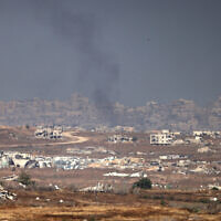 This picture taken from a position in southern Israel on the border with the Gaza Strip shows smoke amid Israeli strikes on May 21, 2025 (Menahem KAHANA / AFP)