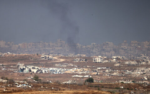 This picture taken from a position in southern Israel on the border with the Gaza Strip shows smoke amid Israeli strikes on May 21, 2025 (Menahem KAHANA / AFP)