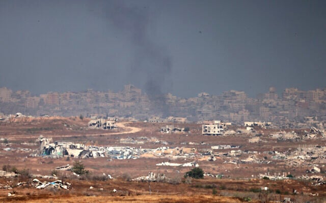 This picture taken from a position in southern Israel on the border with the Gaza Strip shows smoke amid Israeli strikes on May 21, 2025 (Menahem KAHANA / AFP)