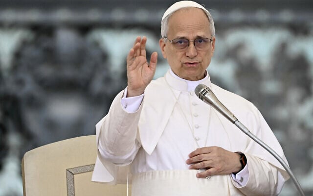 Pope Leo XIV blesses the crowd at the end of his first weekly general audience at St. Peter's Square in The Vatican on May 21, 2025. (Filippo MONTEFORTE / AFP)