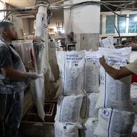 Employees work inside a bakery in Deir el-Balah in the central Gaza Strip, after Israel allowed limited humanitarian aid to enter the Palestinian territory on May 22, 2025.(Eyad BABA / AFP)